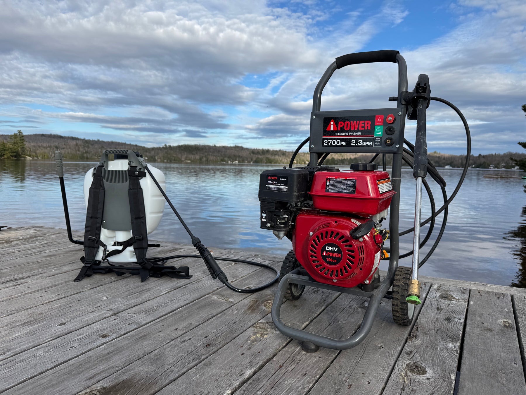 Superior Pressure Washing equipment — pressure washer and soft wash backpack on a lakeside dock in Sault Ste. Marie